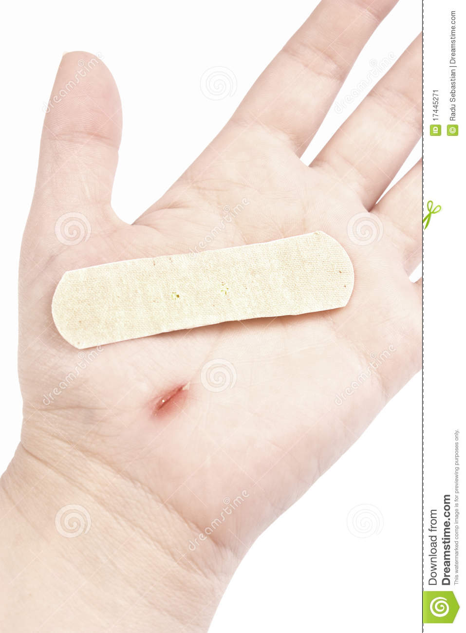 Bandaid Patch On Hand Isolated Over White Background With Clipping
