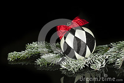 Christmas Ornament With Black And White Diamond Pattern And Red Bow    