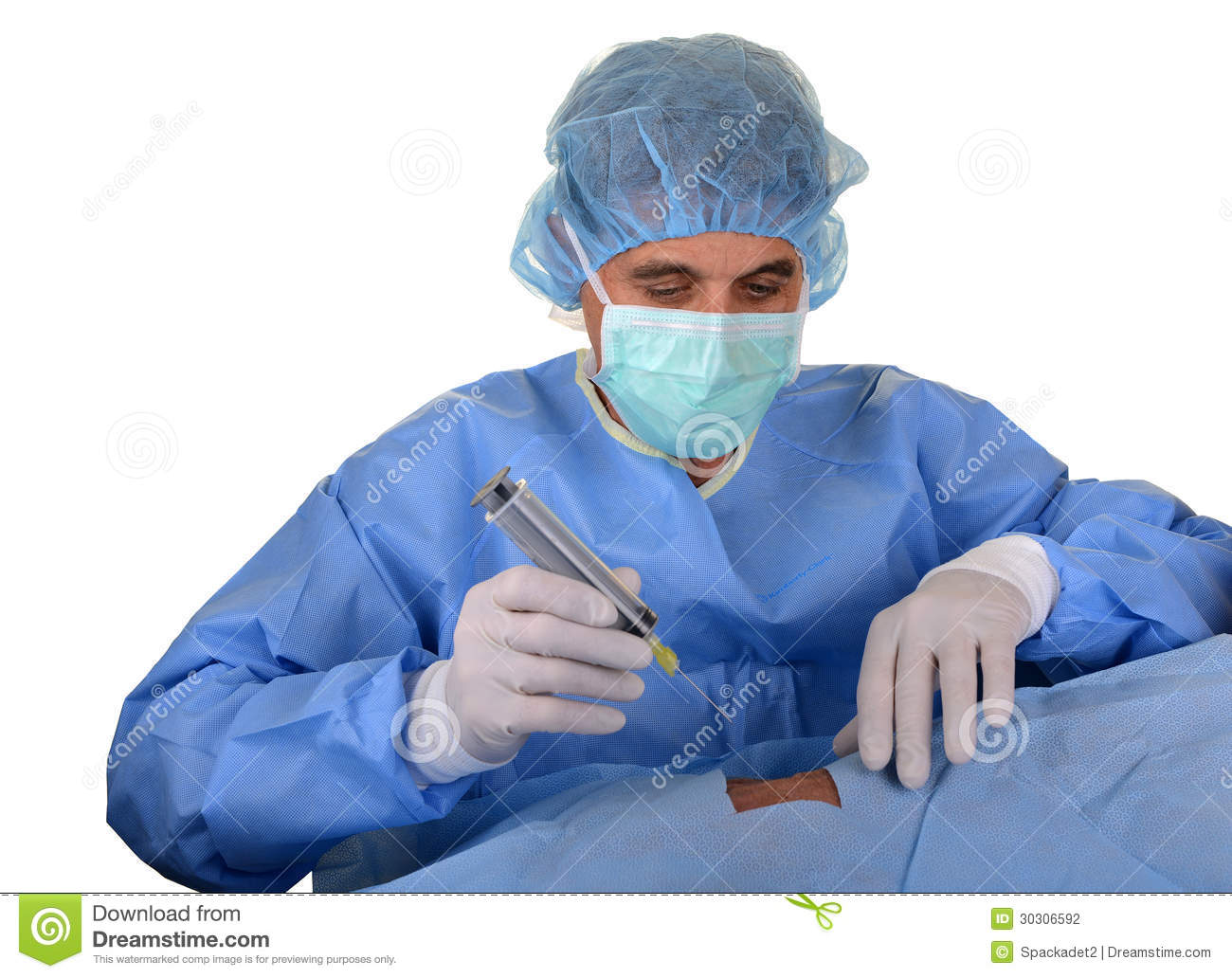 Doctor Wearing Blue Sterile Gown With Hair Cover Mask And Gloves With    