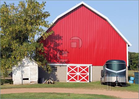 Image Of Red Rustic Barn With A Horse Trailer  Tree And Blue Sky In