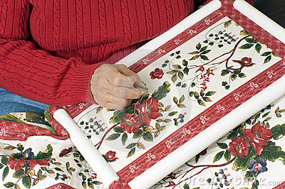 Woman Hand Quilting A Cotton Quilt Using A Plastic Frame 