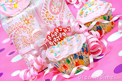 Pink Iced Cupcake With A Happy Birthday Pick Ribbons Around And Party