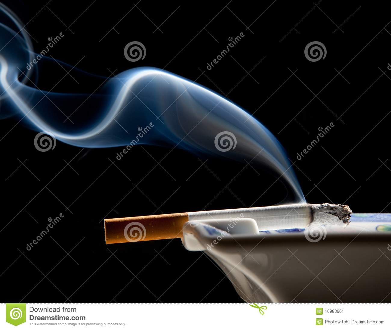 Cigarette On Ashtray With A Beautiful Wisp Of Smoke