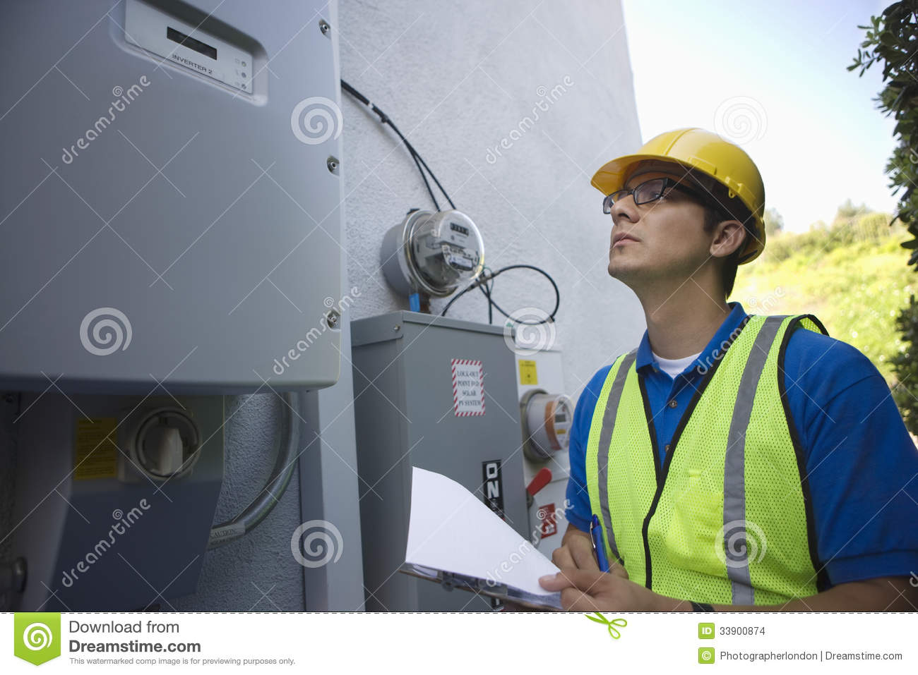 Maintenance Worker Reading Meter Of Solar Generation Stock Images    
