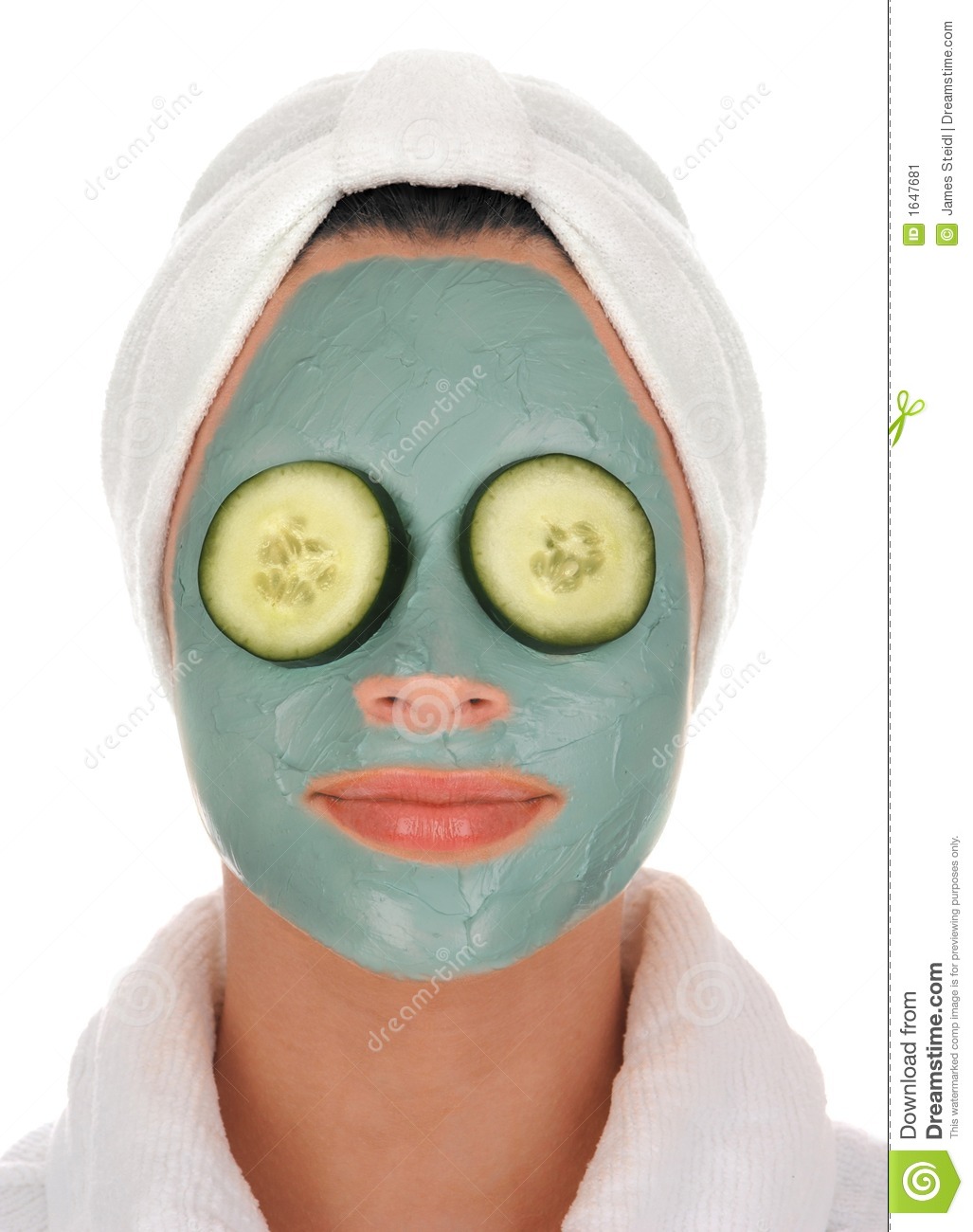 Mud Mask Facial Treatment And Cucumbers Over Eyes On White Background