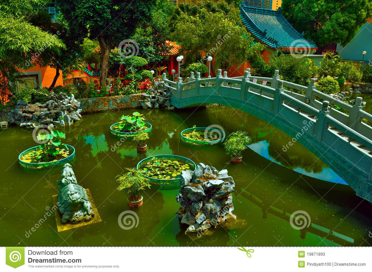 Chinese Zen Garden With Footbridge Zen Rocks And Aquatic Plants    