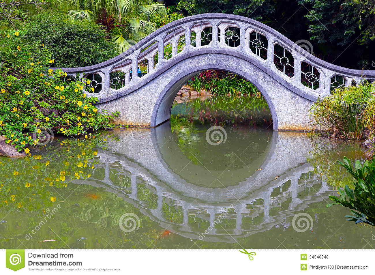 Zen Garden In Autumn With Arch Shaped Bridge And Reflections