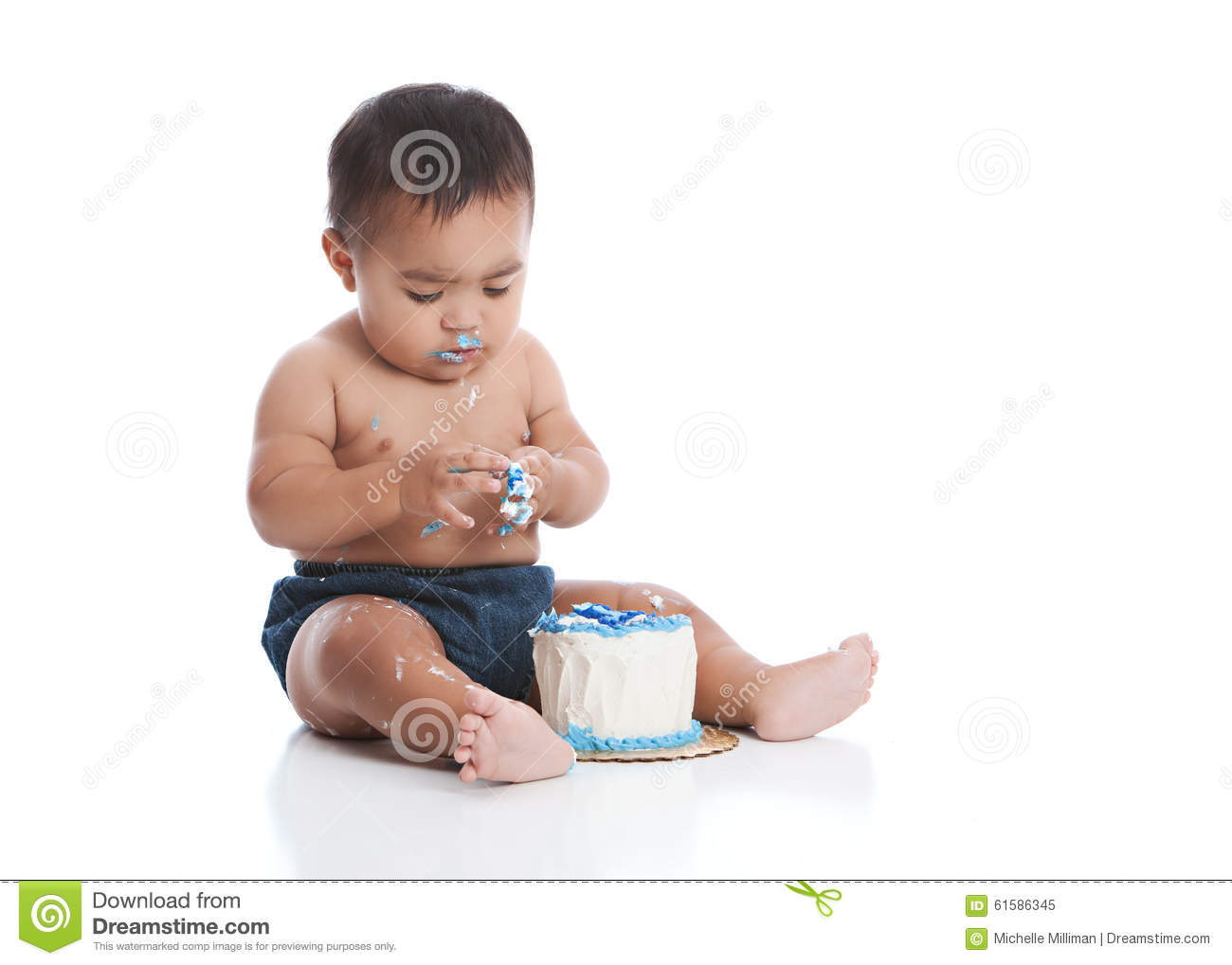 Adorable Mixed Race Baby Boy Eating A Small Birthday Cake  Isolated On