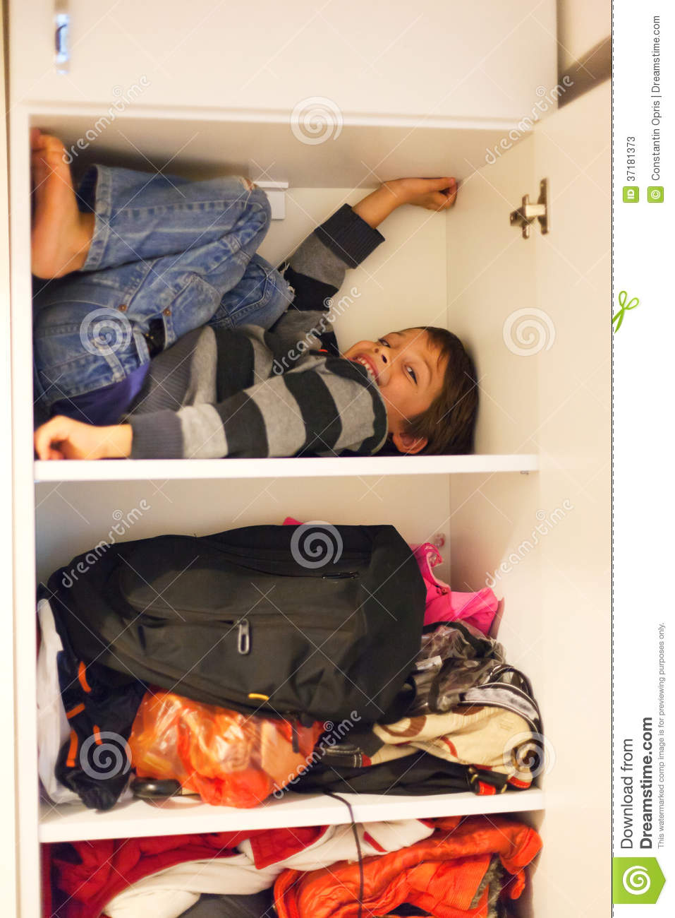 Funny Boy Playing Hide And Seek Hiding In A Closet