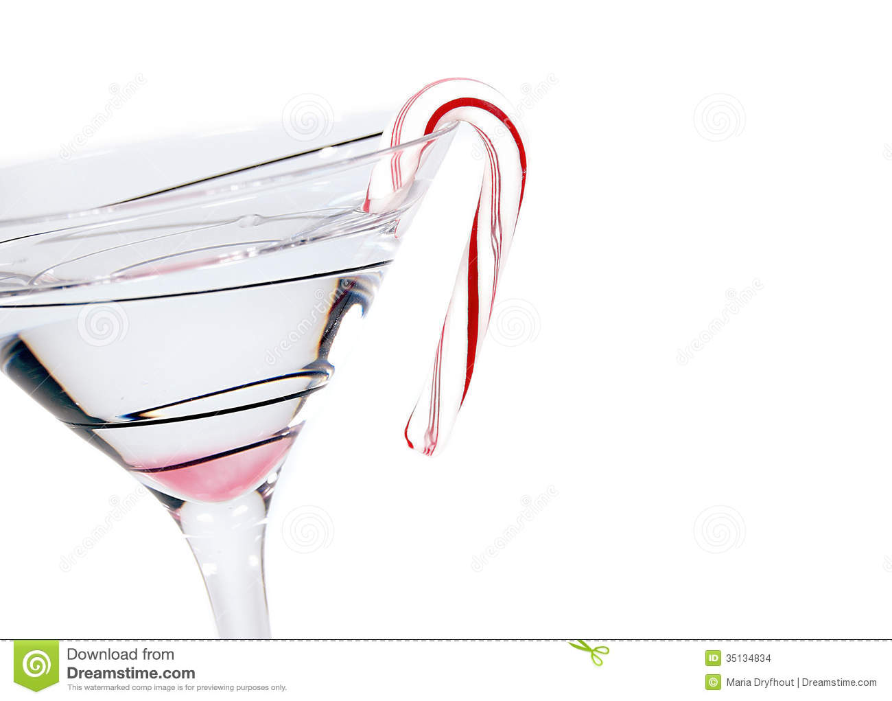 Christmas Candy Cane Hooked On Martini Glass Isolated On White