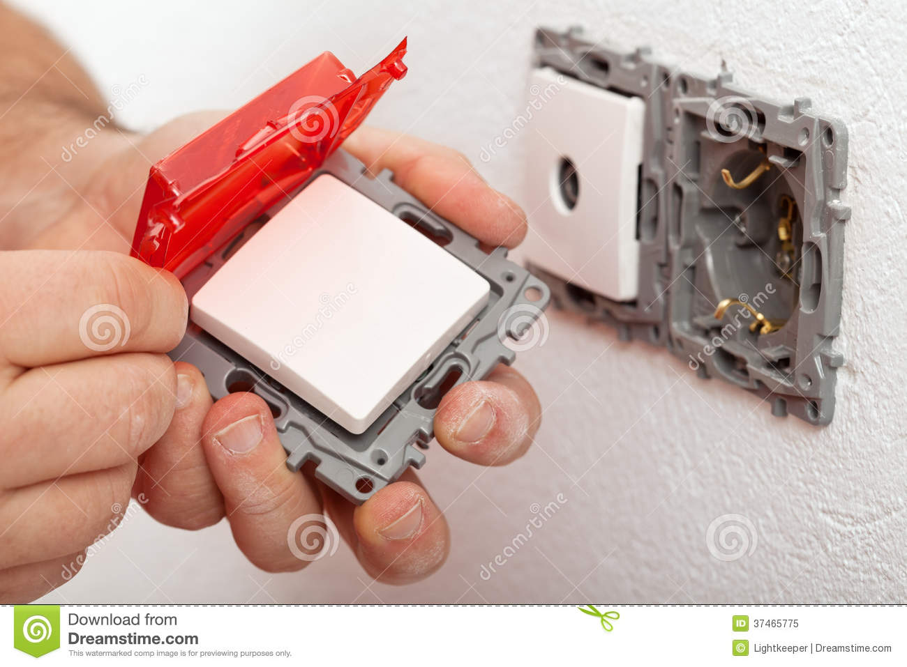 Electrician Hand Changing Or Installing An Electrical Switch Royalty