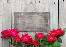 Flowers Bordering Blank Rustic Wooden Sign Hanging On Fence Stock    