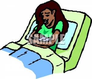 An Ethnic Woman Laying In A Hospital Bed Holding Her Newborn In Her    
