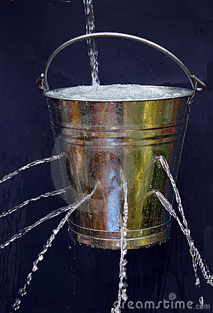 Bucket With Holes Being Filled But With The Water Leaking Out The    