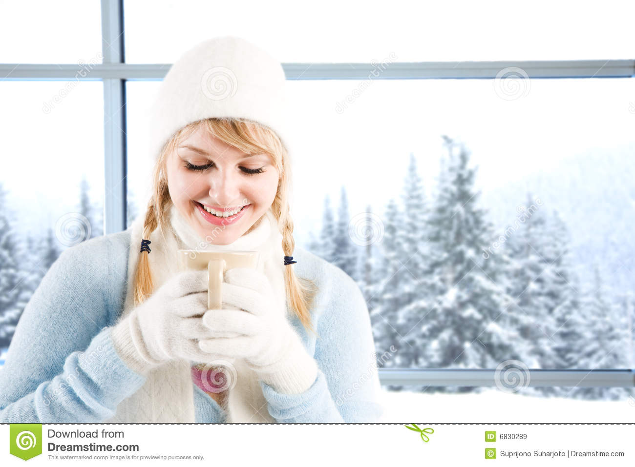 Caucasian Girl Drinking Hot Coffee At A Ski Resort On A Snowy Day