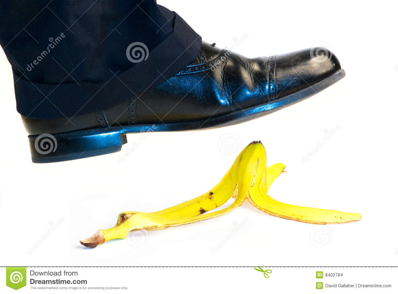 About To Step On A Yellow Banana Peel  Isolated On White Background