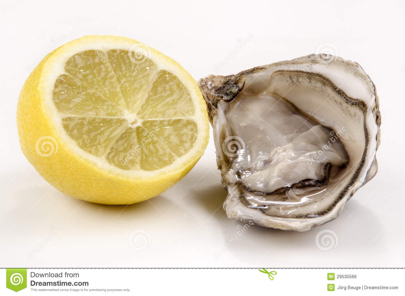 Open Oyster And Half Lemon On A Bright Background