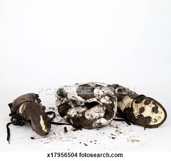 Stock Photo Of Muddy Football Boots And An Old Deflated Ball X17956504    