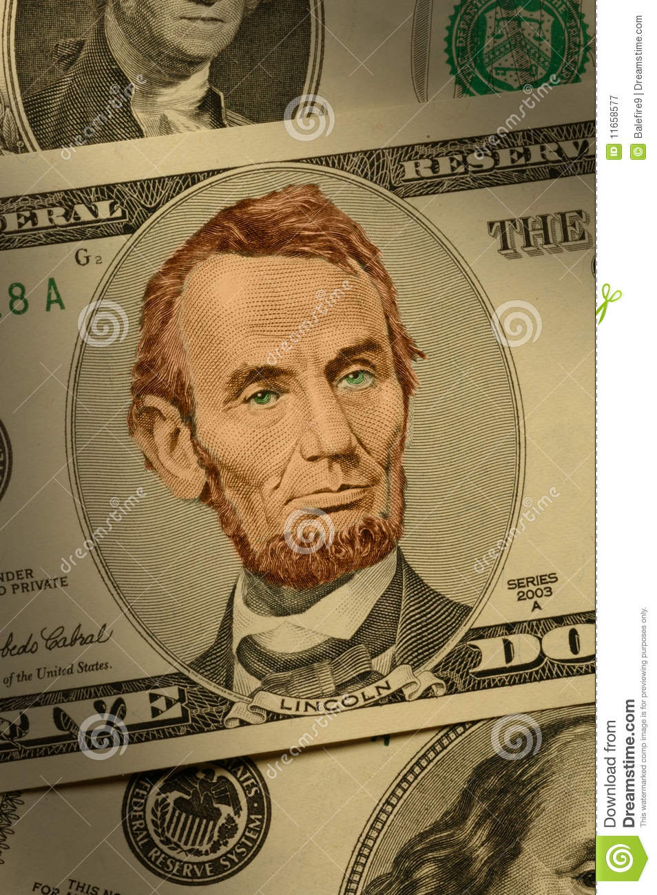 Close Up Of Abraham Lincoln On The  5 Bill Dramatically Lit And Hand