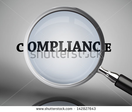 Magnifying Glass Showing Compliance Word On Grey Background   Stock