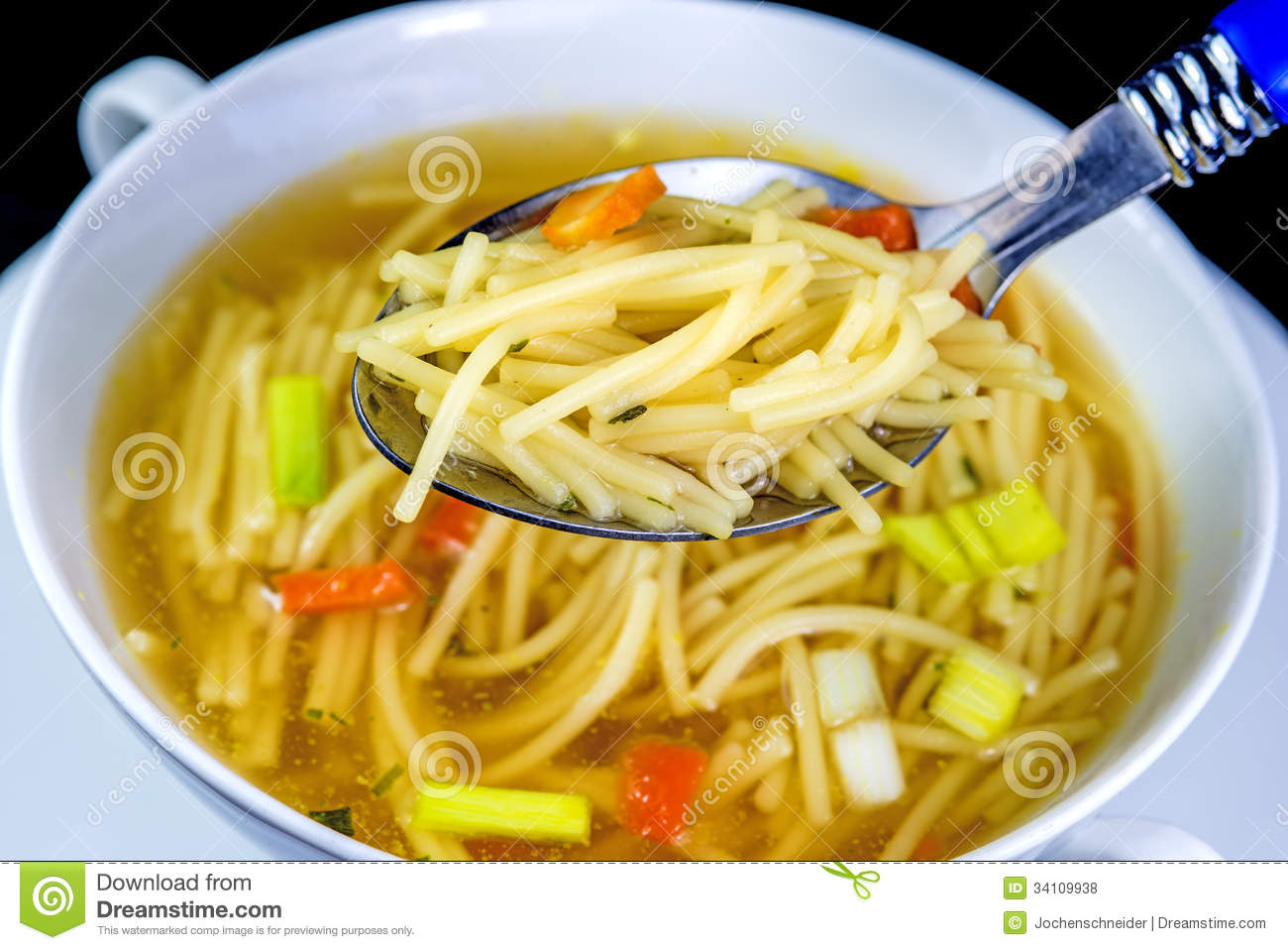 Beef Broth With Noodles Close Up Of A Spoon With Noodles 
