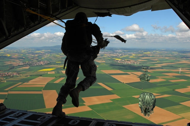 Stock Photo Of A Paratrooper Jumping Out Of An Airplane   Acclaim
