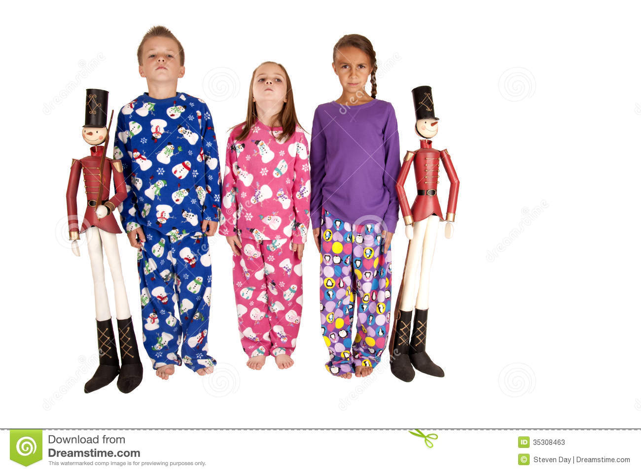 Three Chldren Standing At Attention With Tin Soldiers Stock Photos    