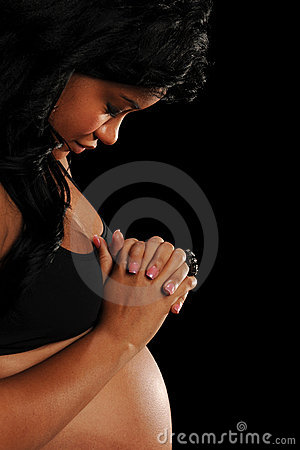 Young African American Woman Pregnant Praying Isolated On A Black    