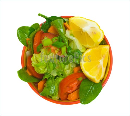 Garden Salad Served With Lemon Wedges Over White Background