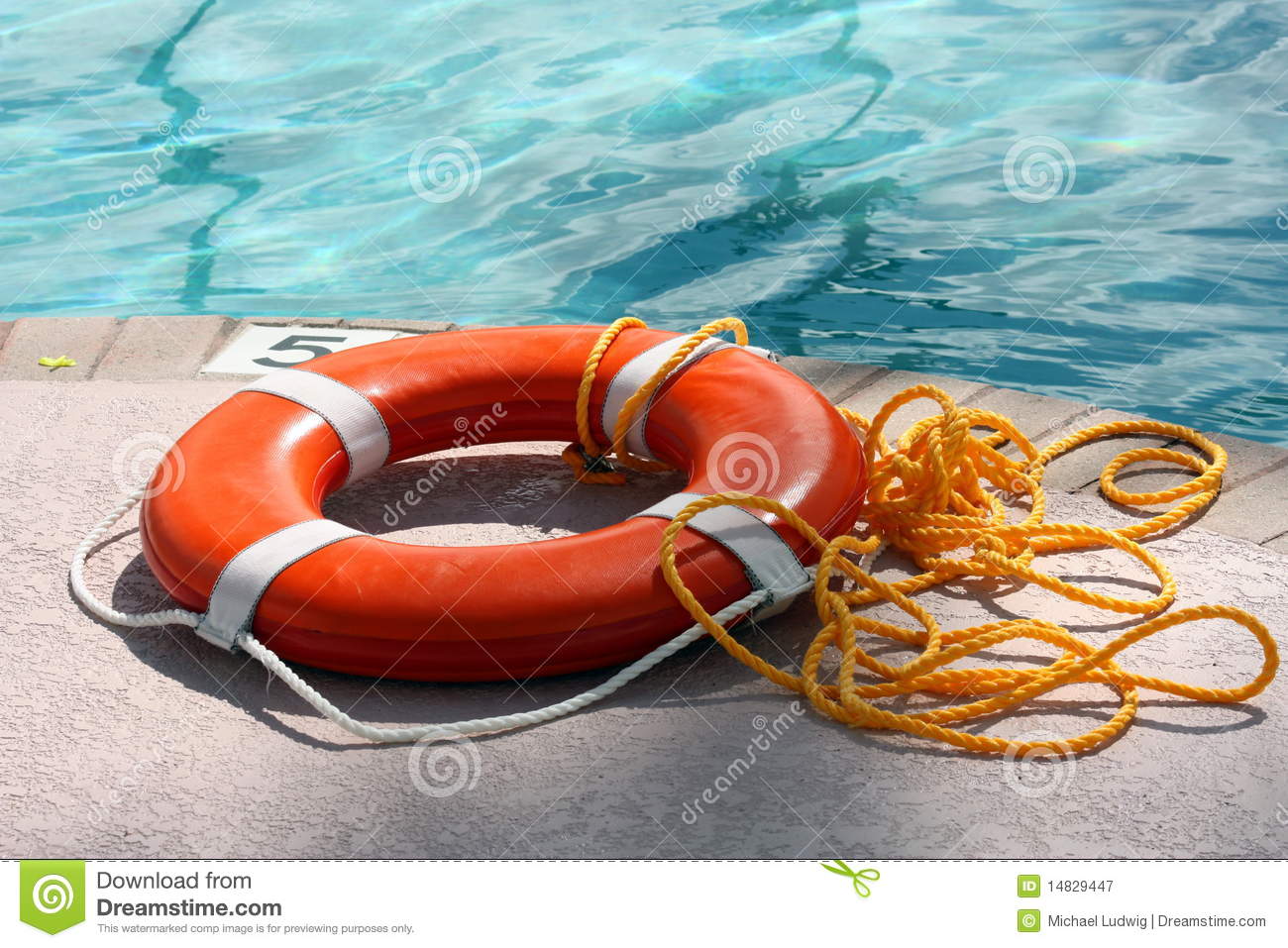 Pool Safety Ring With Throwing Rope By The Swimming Pool