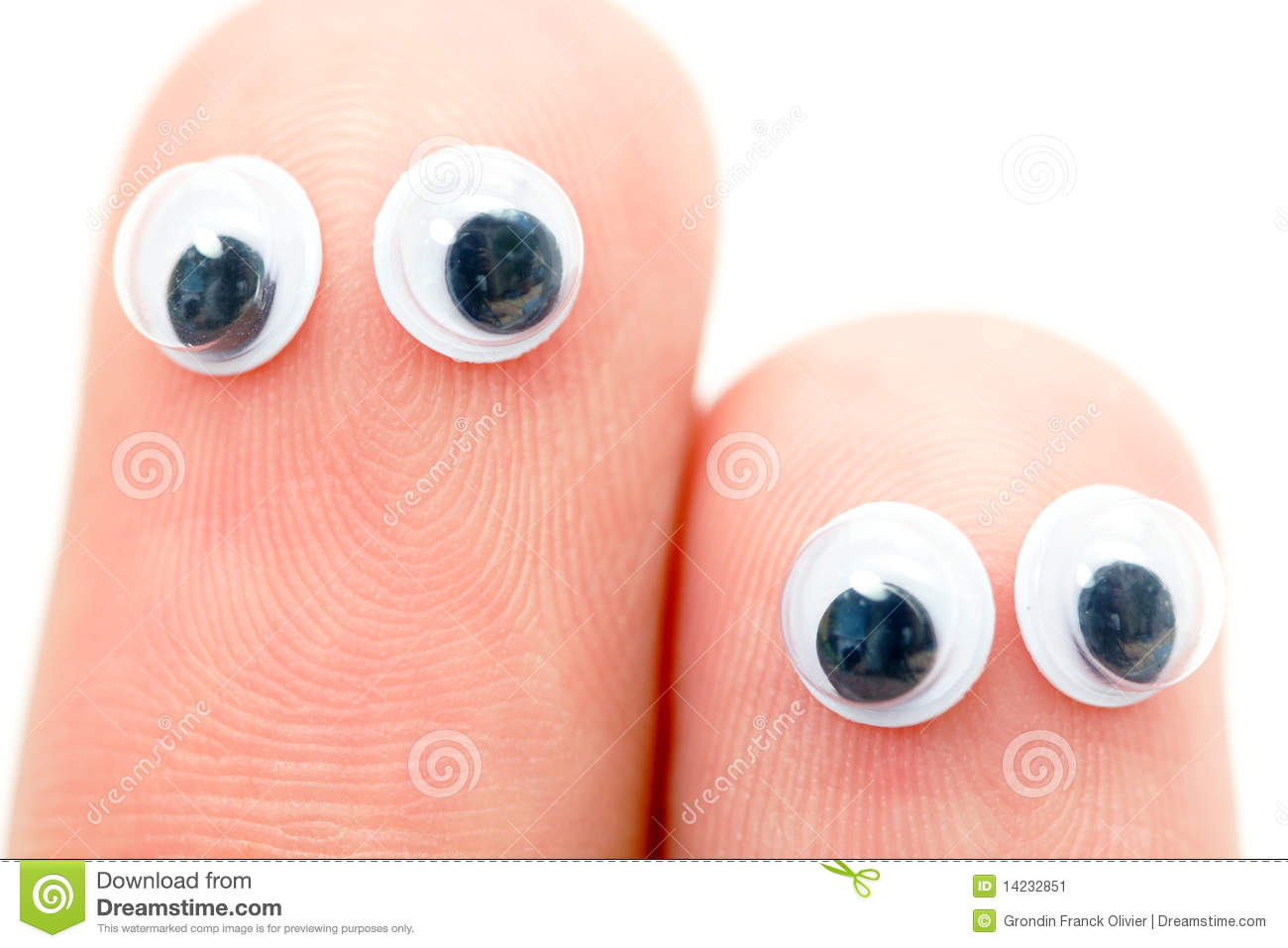 Sticky Wiggle Eyes Stuck On Two Fingers Isolated Against A White    