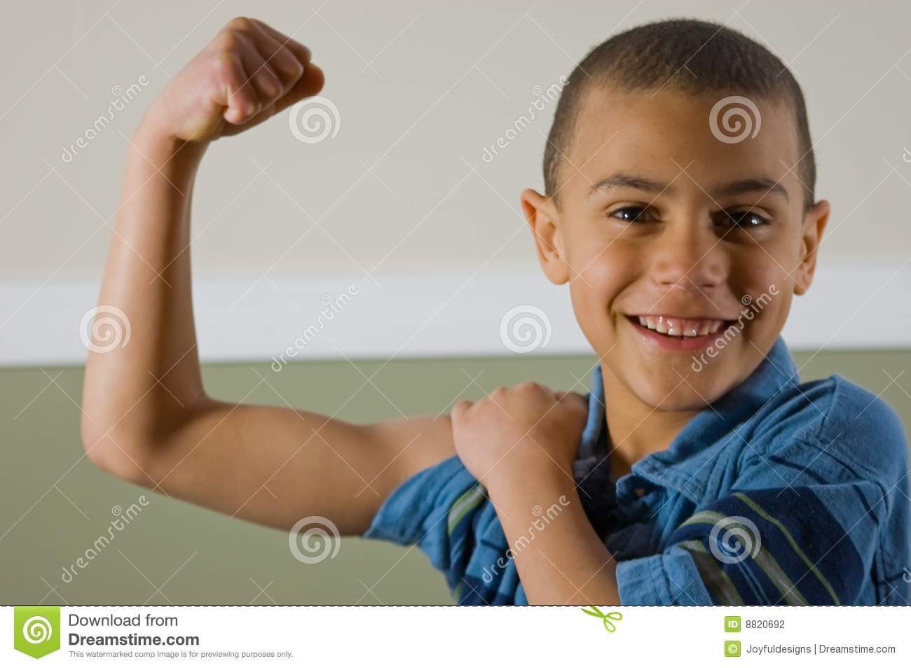 Cute 9 Year Old Multi Racial Boy Is Proudly Showing Off His Muscles    
