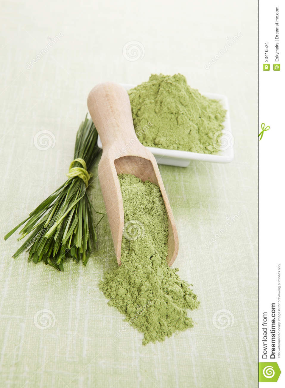 Green Superfood  Wheatgrass Blades And Barley Grass Ground On Wooden
