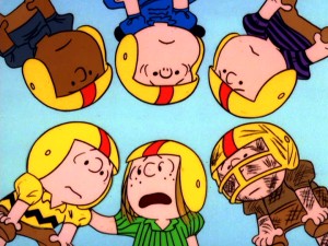 In A Team Huddle Player Coach Peppermint Patty Tells Placekicker