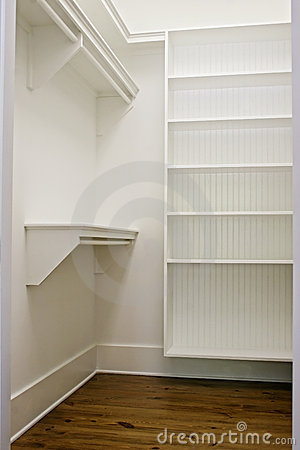 Large White Empty Walk In Closet With Shelves