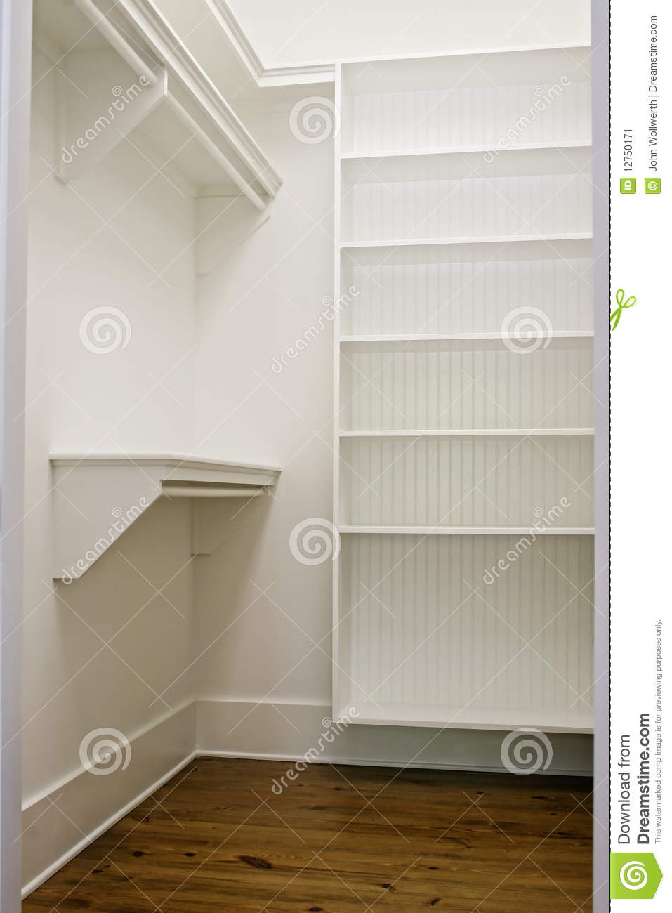 Large White Empty Walk In Closet With Shelves