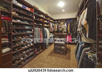 Stock Photograph   Walk In Closet With Organized Clothing  Fotosearch