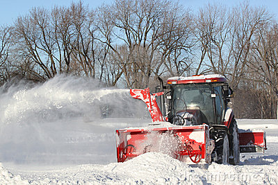 Huge Snow Blower Clears Snow Covered Streets 