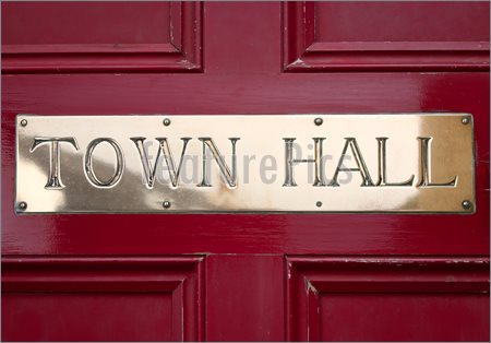 Image Of Brass Town Hall Sign On A Door