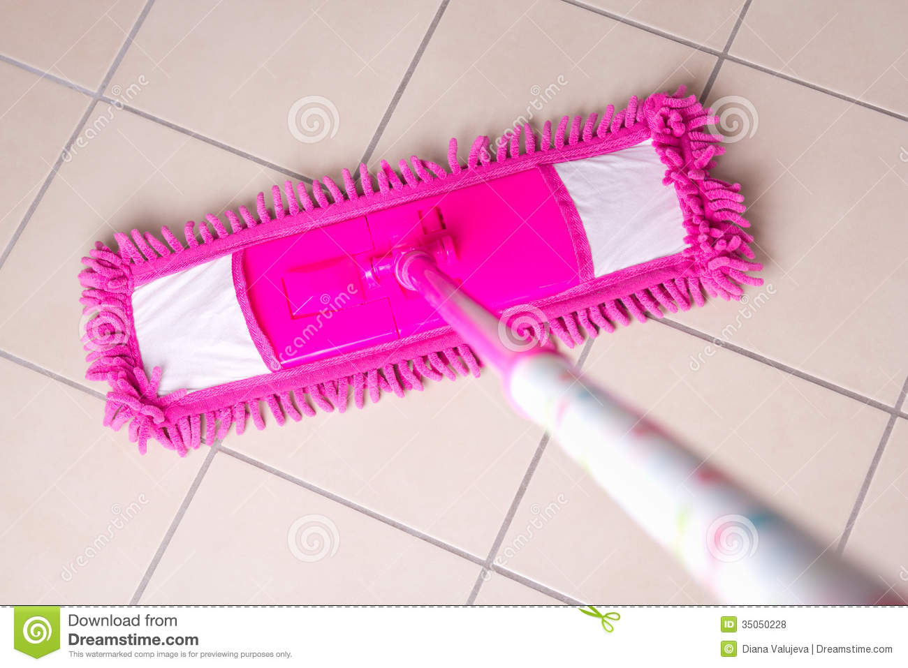 Pink Mop Cleaning Tile Floor In Bathroom Royalty Free Stock Photos