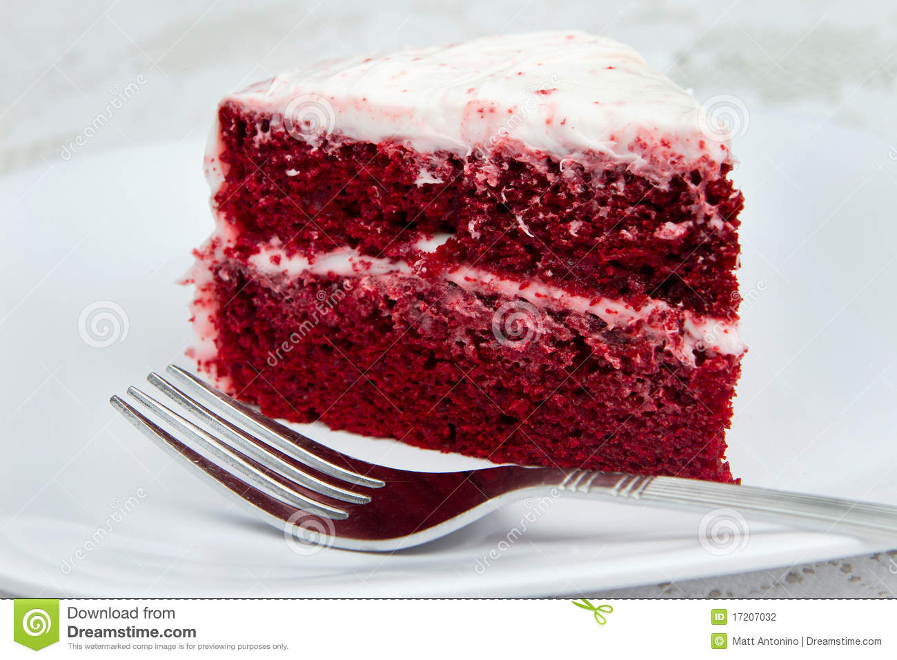 One Slice Of Red Velvet Cake With A Fork On A White Plate