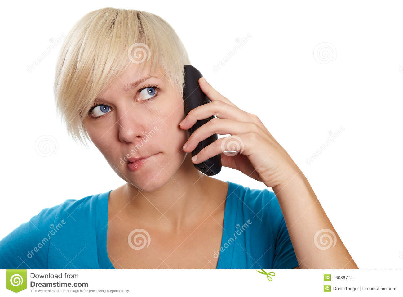 Blonde Young Woman Has A Shy Face While A Phone Call 