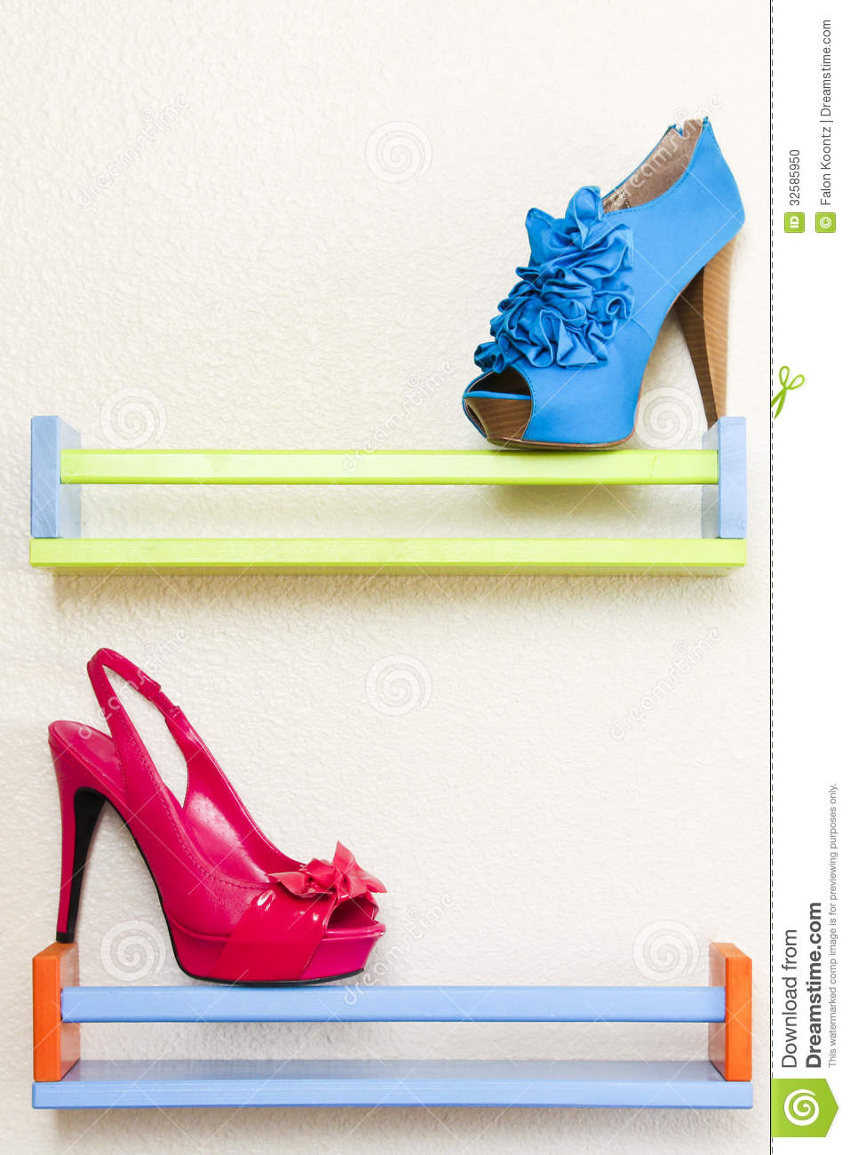 Hot Pink High Heel And Blue Ruffled High Heel Balancing On A Blue And