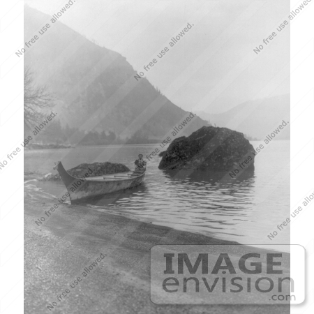 Black And White Image Of A Chinook Man Seated In Rear Of Boat Beached