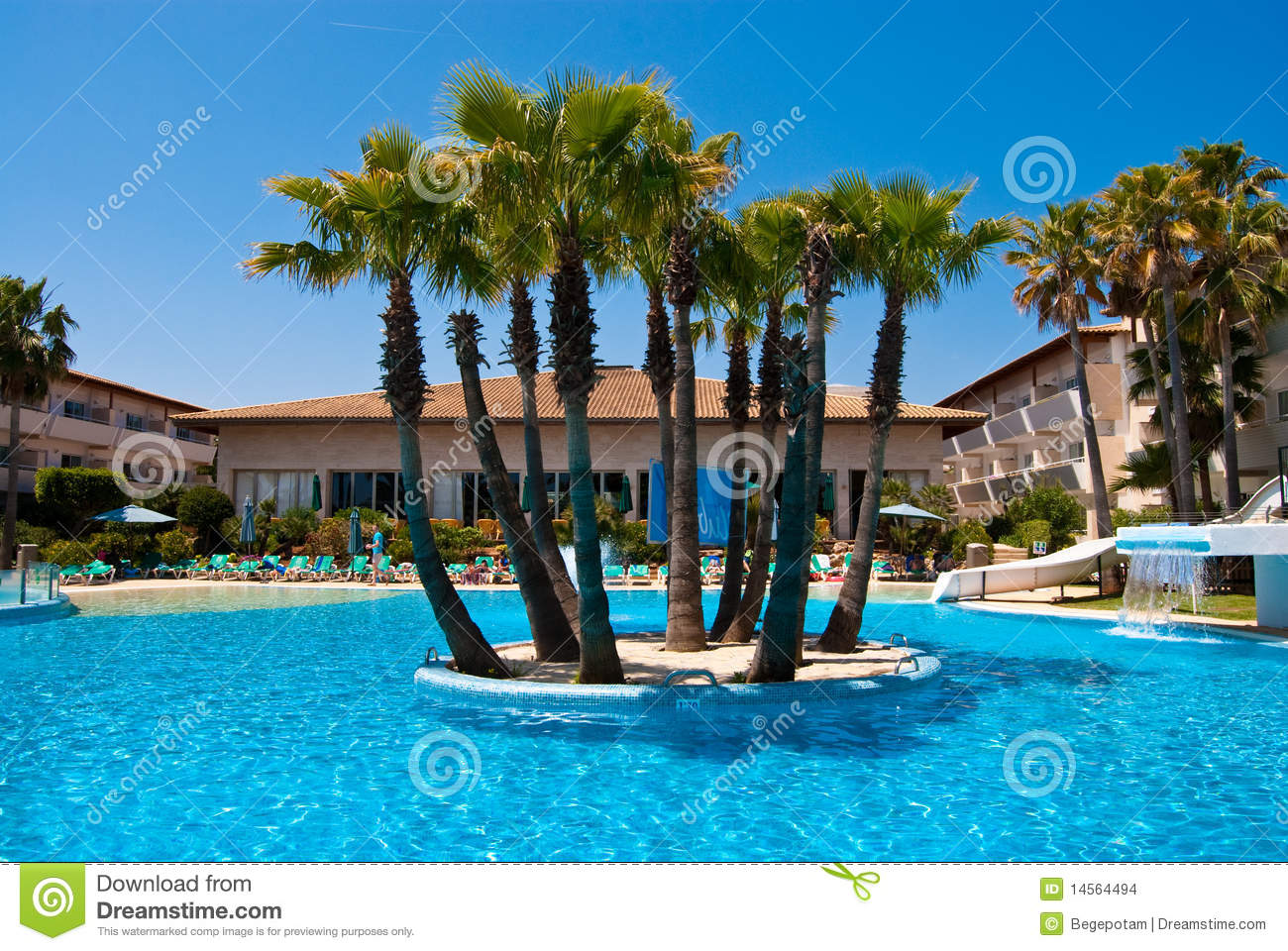 Hotel Swimming Pool With The Palm Island Under The Clear Solid Blue    
