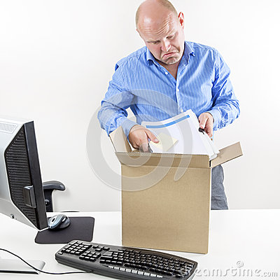     Man Packs His Belongings In A Cardboard Box  Last Day At Work