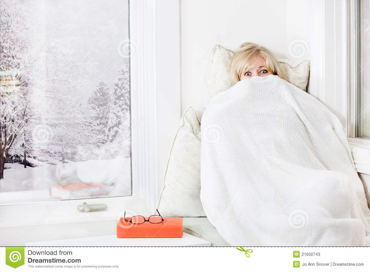Mature Woman Lying Down   Peeking Out From A Warm Blanket