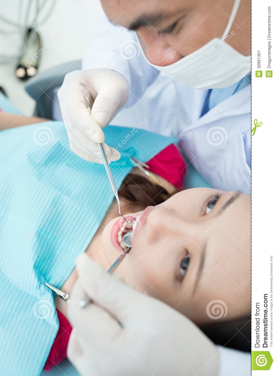 Of A Professional Dentist Carrying Out A Regular Dental Check Up