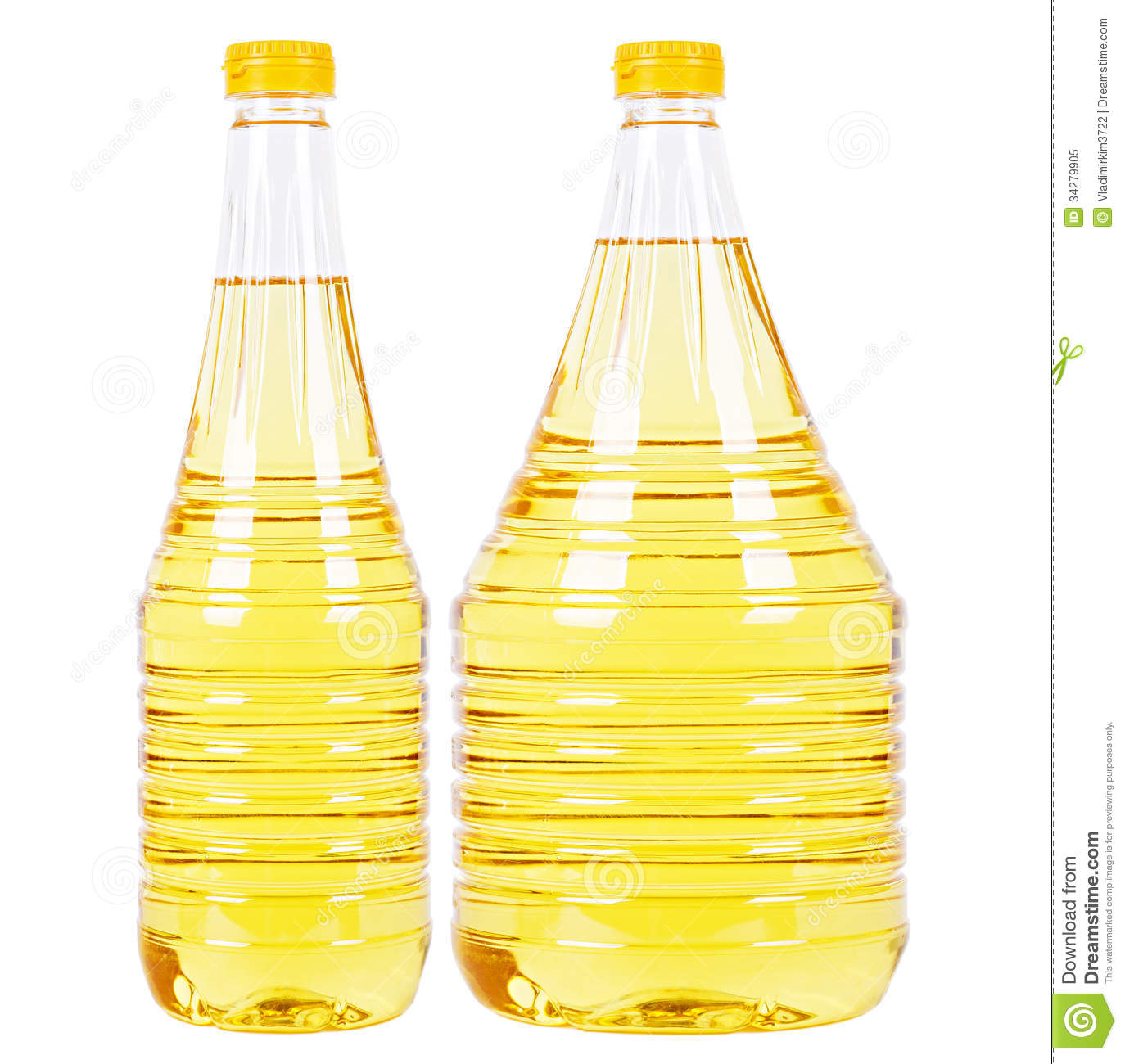 Two Pet Bottles  Thin One And Thick One  Filled With Yellow Vegetable    