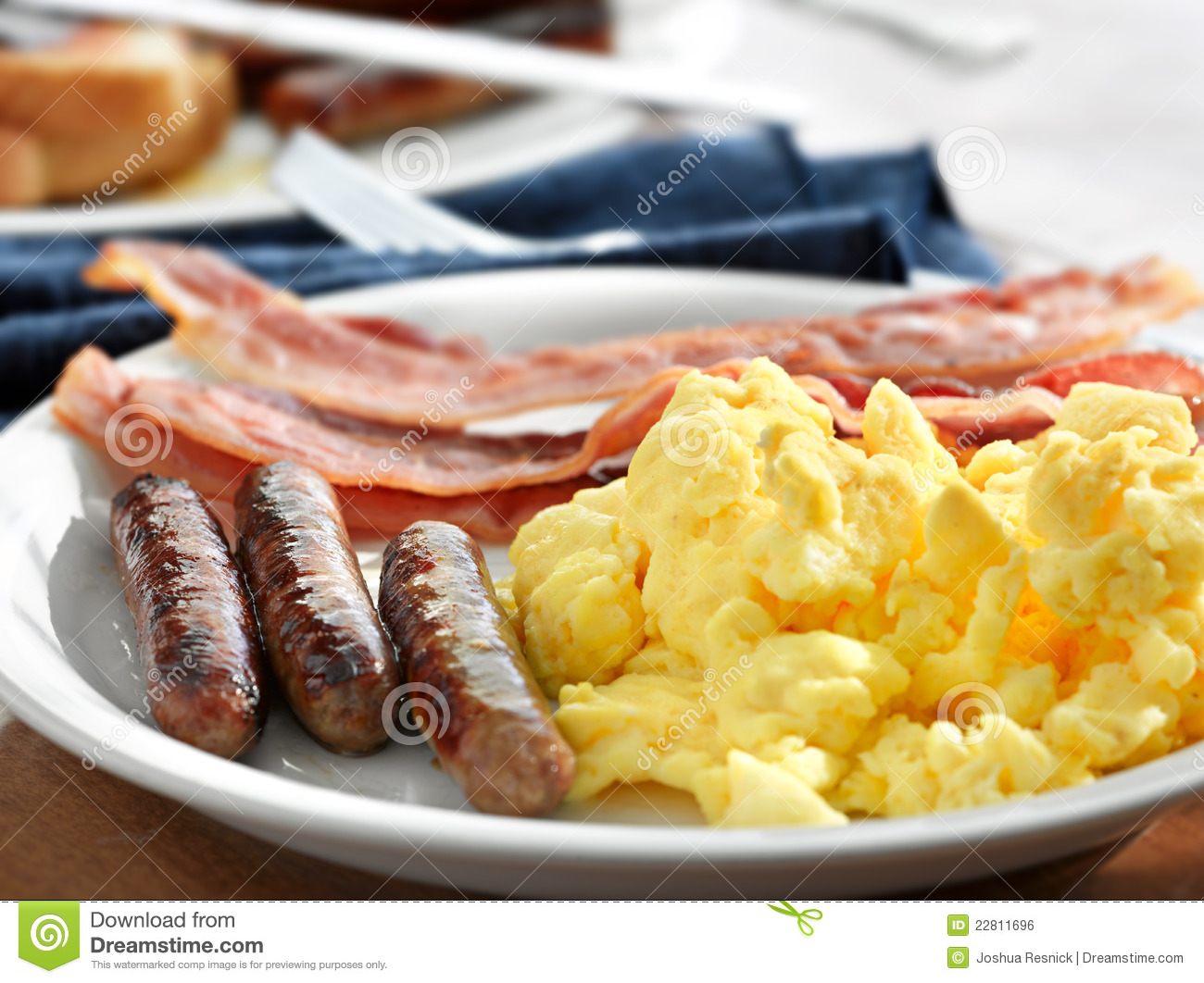 Breakfast Meal With Sausage And Scrambled Eggs With Bacon Shot With